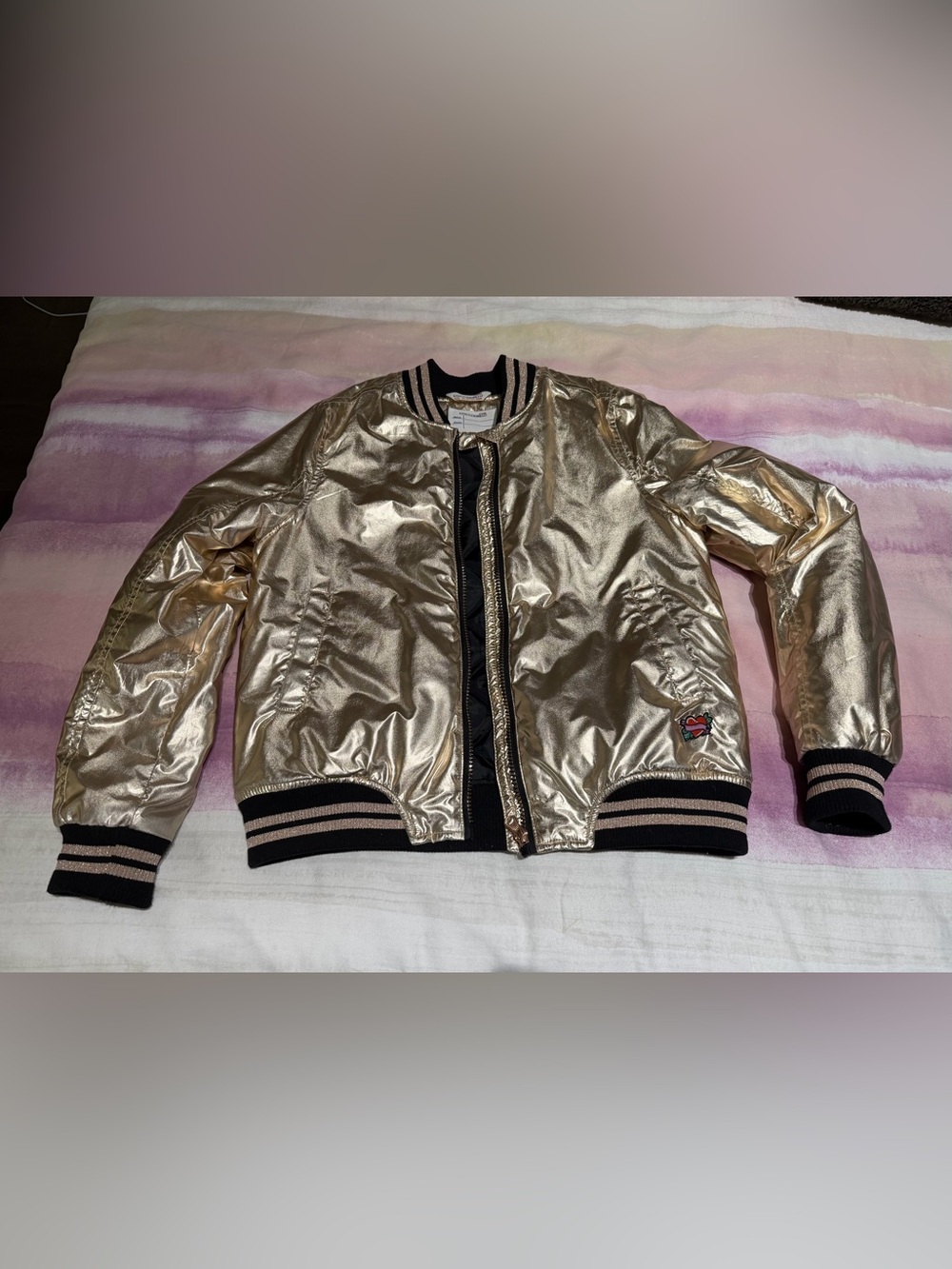 Girls’ gold bomber jacket, size 12
